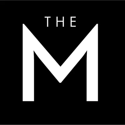 The M Jewelers logo