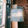 Explore Communications logo